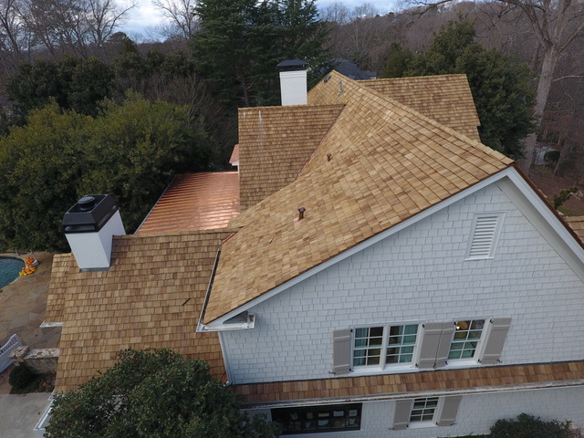 Cedar shingle roof with copper accents on an Atlanta home